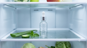 Chilled caffeine eye serum bottle in a fridge door